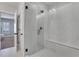 Beautiful glass shower with bright lights and marble tile; the room has a contemporary design at 3920 Cash Lndg, Marietta, GA 30066