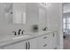 Bright bathroom featuring double sinks with stone countertops and sleek dark hardware at 3920 Cash Lndg, Marietta, GA 30066
