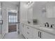Bright bathroom featuring double sinks with stone countertops and sleek dark hardware at 3920 Cash Lndg, Marietta, GA 30066