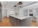Open kitchen with island, gas range and view to the fireplace at 3920 Cash Lndg, Marietta, GA 30066