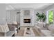 Cozy living room featuring a marble fireplace, comfortable seating, and a stylish decor at 3920 Cash Lndg, Marietta, GA 30066