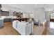 Open-concept living room featuring a modern kitchen with gray cabinets and stainless steel appliances at 3920 Cash Lndg, Marietta, GA 30066