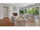 Bright living room with a marble fireplace, comfortable seating, and natural light from a large sliding glass door at 3920 Cash Lndg, Marietta, GA 30066