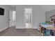 Large playroom featuring soft carpeting, dollhouse, and access to multiple rooms at 3920 Cash Lndg, Marietta, GA 30066