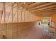 Partially finished attic space with wood framing, flooring, and natural light from window at the end at 109 Hawks Bnd, Canton, GA 30115