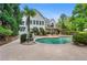 Backyard view of pool, patio and multi-level deck; perfect for entertaining at 109 Hawks Bnd, Canton, GA 30115
