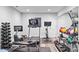 Modern home gym featuring state-of-the-art exercise equipment and accessories on hardwood floors at 109 Hawks Bnd, Canton, GA 30115