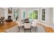 Bright dining area featuring a round table, seating for four, and multiple windows at 109 Hawks Bnd, Canton, GA 30115