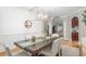 A lovely dining room with a long table, decor, and a view of the living room at 109 Hawks Bnd, Canton, GA 30115
