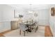 A beautiful dining room with hardwood floors, decor, and a modern light fixture at 109 Hawks Bnd, Canton, GA 30115