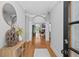 Inviting foyer with hardwood floors, arched doorways, and elegant decor leading to the living spaces at 109 Hawks Bnd, Canton, GA 30115