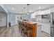 Bright kitchen with white cabinetry, stainless steel appliances, and a breakfast bar at 109 Hawks Bnd, Canton, GA 30115