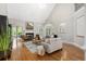 Inviting living room with hardwood floors, vaulted ceiling, fireplace, and comfortable seating at 109 Hawks Bnd, Canton, GA 30115