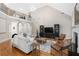 An airy living room with hardwood floors, vaulted ceilings, fireplace, and lots of light at 109 Hawks Bnd, Canton, GA 30115
