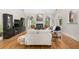 A stylish living room has hardwood floors, lots of light, fireplace, and vaulted ceilings at 109 Hawks Bnd, Canton, GA 30115