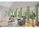 Bright living room featuring natural light, hardwood floors, and designer curtains at 109 Hawks Bnd, Canton, GA 30115