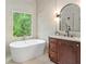 Featuring a marble vanity, free-standing tub, and a window that provides natural light at 109 Hawks Bnd, Canton, GA 30115
