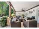 Spacious covered patio featuring comfortable seating, ceiling fan and outdoor decor at 109 Hawks Bnd, Canton, GA 30115