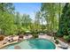 Backyard pool area featuring a gazebo and outdoor seating areas at 109 Hawks Bnd, Canton, GA 30115