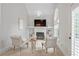 Comfortable sitting area with vaulted ceiling, fireplace, built-in shelves, and chandelier at 109 Hawks Bnd, Canton, GA 30115
