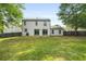 Large backyard showcasing the home's exterior, green lawn, and privacy fence at 1758 Bridgestone Ct, Marietta, GA 30066