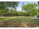 Large backyard with mature trees and a privacy fence provides plenty of room for outdoor activities at 1758 Bridgestone Ct, Marietta, GA 30066