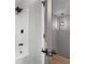 Bathroom featuring white tile shower, black hardware, and pendant light at 1758 Bridgestone Ct, Marietta, GA 30066