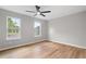Bright bedroom with hardwood floors, two windows, and a ceiling fan at 1758 Bridgestone Ct, Marietta, GA 30066