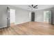 Bedroom featuring wood floors, ceiling fan, closet and grey painted doors at 1758 Bridgestone Ct, Marietta, GA 30066