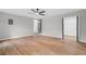 Bedroom featuring wood floors, ceiling fan, and access to both a bathroom and a walk-in closet at 1758 Bridgestone Ct, Marietta, GA 30066