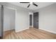 Bedroom featuring wood floors, a ceiling fan, and two closets at 1758 Bridgestone Ct, Marietta, GA 30066