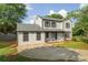 Charming two-story home with a new roof, siding, a driveway, and a lush green lawn at 1758 Bridgestone Ct, Marietta, GA 30066