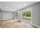 Spacious living room with wood floors and sliding glass doors that provide natural light and backyard access at 1758 Bridgestone Ct, Marietta, GA 30066