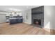Open-concept living space features hardwood floors, a fireplace, and seamless flow to the kitchen at 1758 Bridgestone Ct, Marietta, GA 30066