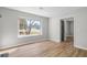 Bright living room showcasing hardwood floors, neutral paint, and a large window with natural light at 1758 Bridgestone Ct, Marietta, GA 30066