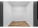 Walk-in closet featuring wood floors and a built-in wire shelf for storage, providing an organized space at 1758 Bridgestone Ct, Marietta, GA 30066
