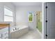 Bathroom featuring a soaking tub, a shower, and cabinetry offering a spa-like experience at 2400 Honey Ct, Mcdonough, GA 30252