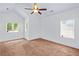 Bright bedroom with carpet flooring and windows, creating a cozy retreat at 2400 Honey Ct, Mcdonough, GA 30252