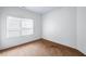 Bedroom featuring neutral carpet, a large window with blinds, and neutral paint at 2400 Honey Ct, Mcdonough, GA 30252
