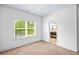 Bedroom featuring neutral carpet, window with blind, neutral paint colors, and access to bathroom at 2400 Honey Ct, Mcdonough, GA 30252