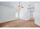Cozy bedroom with a ceiling fan, carpeted floor, and a view at 2400 Honey Ct, Mcdonough, GA 30252