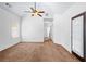 Bedroom featuring plush carpeting, ceiling fan, and a door to a private outdoor space at 2400 Honey Ct, Mcdonough, GA 30252