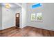 Bright foyer featuring hardwood floors, a high ceiling, and natural light at 2400 Honey Ct, Mcdonough, GA 30252