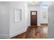 Elegant foyer featuring hardwood floors and an entryway with a decorative window at 2400 Honey Ct, Mcdonough, GA 30252