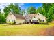 Charming one-story home featuring a stone accent and a well-maintained lawn at 2400 Honey Ct, Mcdonough, GA 30252
