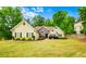 Charming one-story home featuring a stone accent and a well-maintained lawn at 2400 Honey Ct, Mcdonough, GA 30252