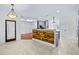 Open kitchen layout with an island bar, stainless steel appliances, and a tiled floor at 2400 Honey Ct, Mcdonough, GA 30252