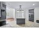Modern kitchen with granite countertops, stainless steel appliances, and an island bar at 2400 Honey Ct, Mcdonough, GA 30252