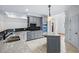 Bright kitchen featuring gray cabinetry, granite countertops, stainless appliances, and a center island at 2400 Honey Ct, Mcdonough, GA 30252