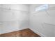 Spacious walk-in closet with white walls and multiple wire shelves for optimal storage and organization at 2400 Honey Ct, Mcdonough, GA 30252